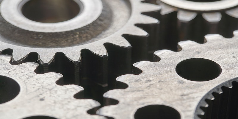 cogs to signify uses of precision machining