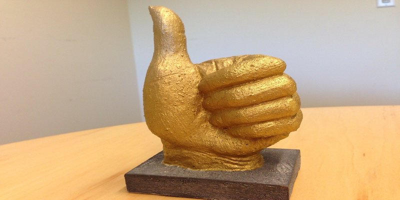 thumbs up statue to represent advantages of cnc milling