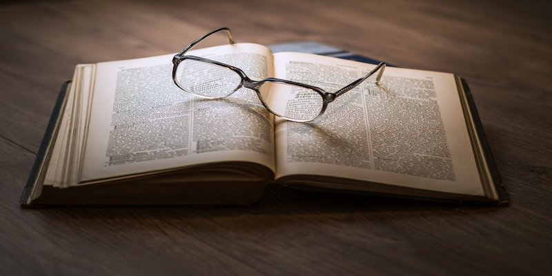 glasses resting on book
